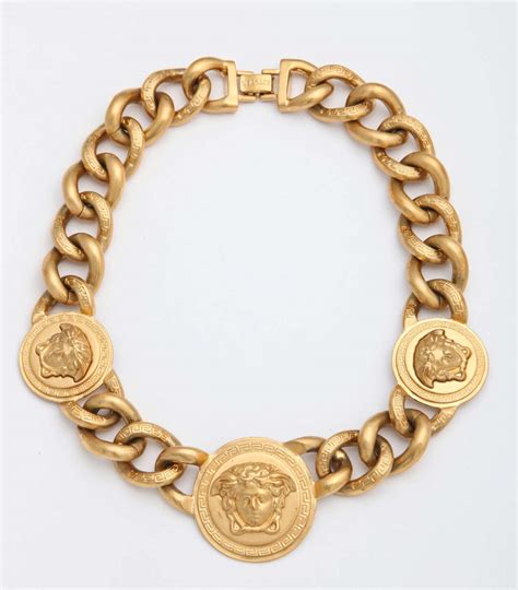 versace bijoux or|Versace gold label jewelry.